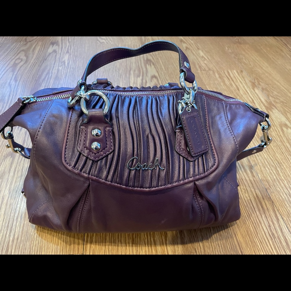 Coach purse. Dark plum with silver details.